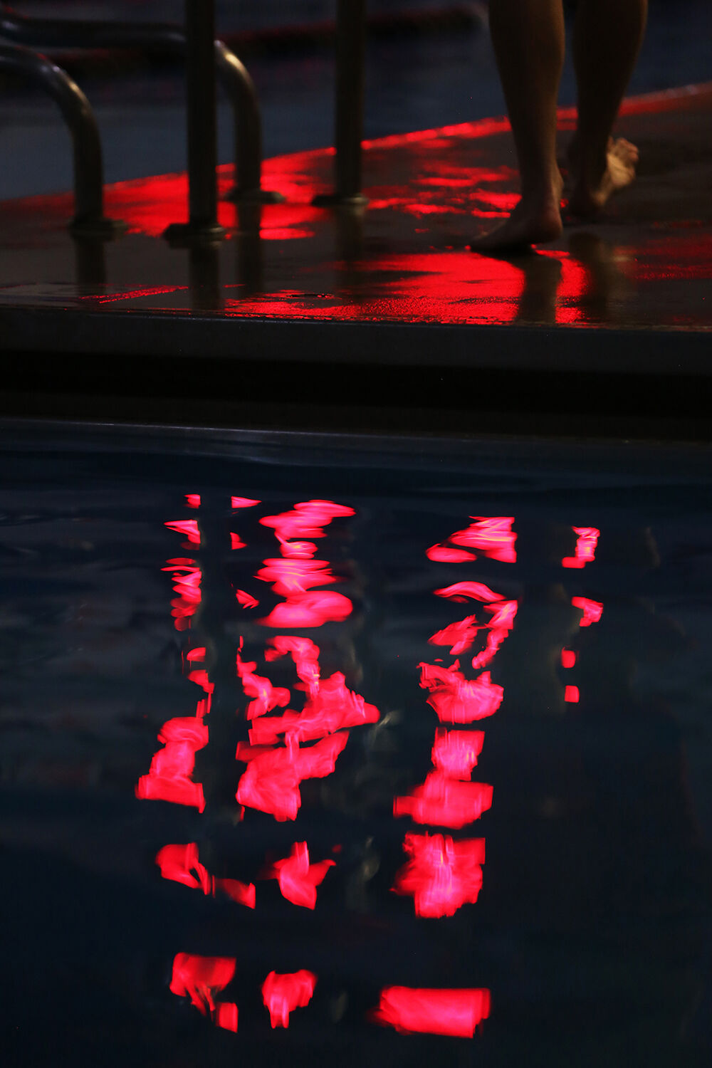 The time board reflects over the pool deck